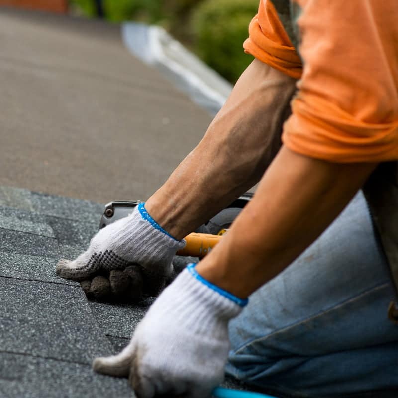 Roofing crew working on a residential roof in Tennessee